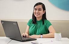 Women_In_Green_Shirt_With_Computer